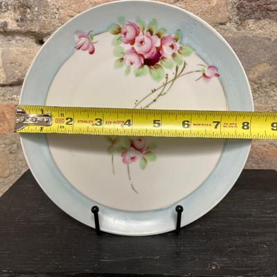 Sale Photo Thumbnail #305: Two handled footed bonbon with roses, single handled tidbit, two 7 3/4” plates and three beautiful 6 1/2” plates, all hand panted