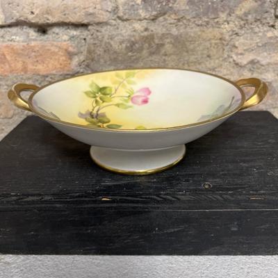 Sale Photo Thumbnail #301: Two handled footed bonbon with roses, single handled tidbit, two 7 3/4” plates and three beautiful 6 1/2” plates, all hand panted