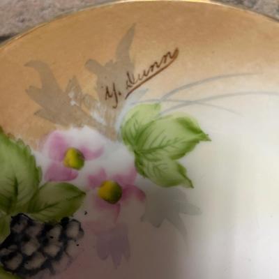 Sale Photo Thumbnail #308: Two handled footed bonbon with roses, single handled tidbit, two 7 3/4” plates and three beautiful 6 1/2” plates, all hand panted