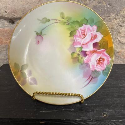 Sale Photo Thumbnail #309: Two handled footed bonbon with roses, single handled tidbit, two 7 3/4” plates and three beautiful 6 1/2” plates, all hand panted