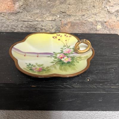Sale Photo Thumbnail #303: Two handled footed bonbon with roses, single handled tidbit, two 7 3/4” plates and three beautiful 6 1/2” plates, all hand panted
