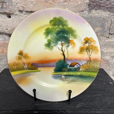 Sale Photo Thumbnail #318: Beautiful pieces! 3 toed nut dish, single-handled tidbit, two 7 3/4” plates and. One 6 1/2” plate, all hand painted