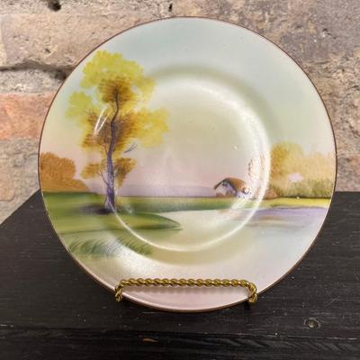 Sale Photo Thumbnail #319: Beautiful pieces! 3 toed nut dish, single-handled tidbit, two 7 3/4” plates and. One 6 1/2” plate, all hand painted
