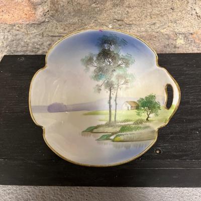Sale Photo Thumbnail #315: Beautiful pieces! 3 toed nut dish, single-handled tidbit, two 7 3/4” plates and. One 6 1/2” plate, all hand painted
