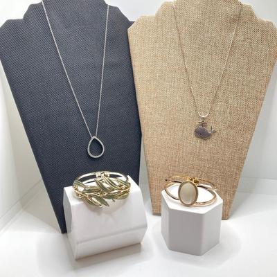 LOT 256: Teardrop and Whale Pendant Necklaces with Pair of Hinged Cuff Bracelets