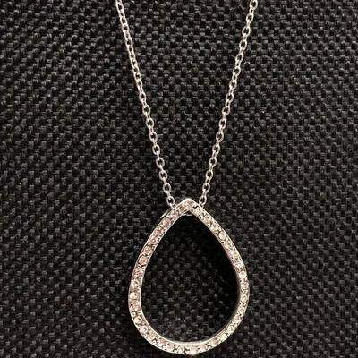 LOT 256: Teardrop and Whale Pendant Necklaces with Pair of Hinged Cuff Bracelets