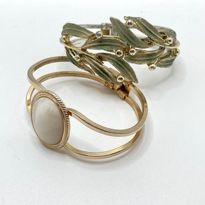 LOT 256: Teardrop and Whale Pendant Necklaces with Pair of Hinged Cuff Bracelets