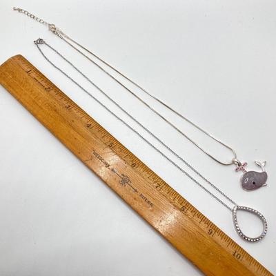 LOT 256: Teardrop and Whale Pendant Necklaces with Pair of Hinged Cuff Bracelets