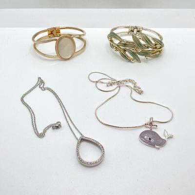 LOT 256: Teardrop and Whale Pendant Necklaces with Pair of Hinged Cuff Bracelets