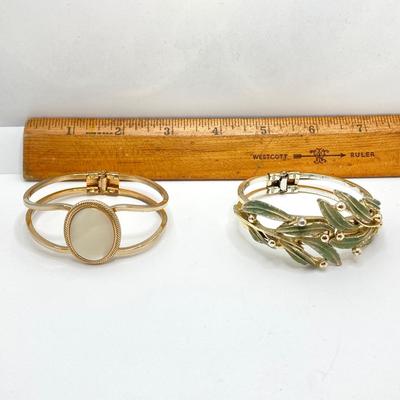 LOT 256: Teardrop and Whale Pendant Necklaces with Pair of Hinged Cuff Bracelets