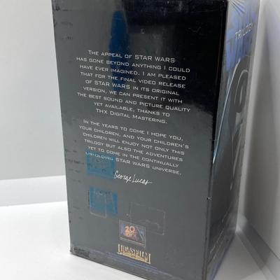 LOT 262: Vintage Darth Vader Mask, Star Wars Trilogy VHS Set, Hallmark Batman / Indiana Jones Ornaments and "The Menacing...