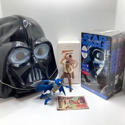 LOT 262: Vintage Darth Vader Mask, Star Wars Trilogy VHS Set, Hallmark Batman / Indiana Jones Ornaments and "The Menacing...