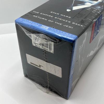 LOT 262: Vintage Darth Vader Mask, Star Wars Trilogy VHS Set, Hallmark Batman / Indiana Jones Ornaments and "The Menacing...