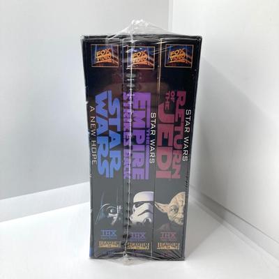 LOT 262: Vintage Darth Vader Mask, Star Wars Trilogy VHS Set, Hallmark Batman / Indiana Jones Ornaments and "The Menacing...