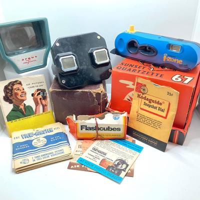 LOT 266: Vintage Viewfinders / Reels, Flash Bulbs, Polaroid Instant Pocket Camera and Sunset Quartzette 67 Lamp in Original Box