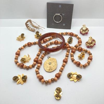 LOT 268: Flora Book Style Storage filled with Large Collection of Fashion Jewelry - Art and Huppke Included