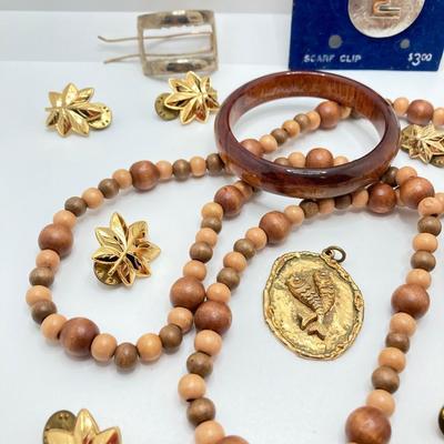 LOT 268: Flora Book Style Storage filled with Large Collection of Fashion Jewelry - Art and Huppke Included