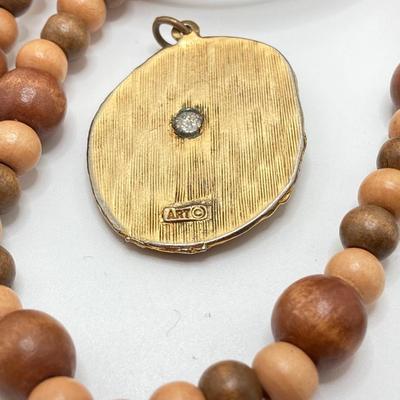 LOT 268: Flora Book Style Storage filled with Large Collection of Fashion Jewelry - Art and Huppke Included