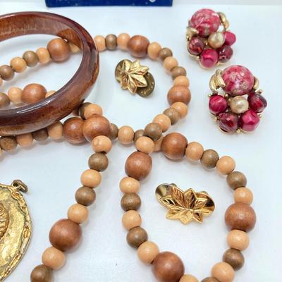 LOT 268: Flora Book Style Storage filled with Large Collection of Fashion Jewelry - Art and Huppke Included