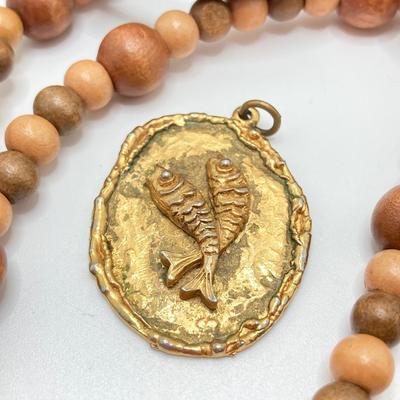 LOT 268: Flora Book Style Storage filled with Large Collection of Fashion Jewelry - Art and Huppke Included