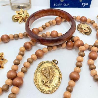 LOT 268: Flora Book Style Storage filled with Large Collection of Fashion Jewelry - Art and Huppke Included