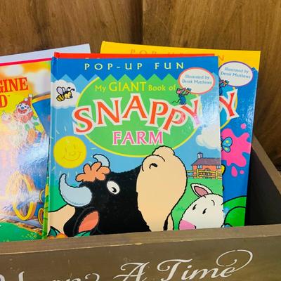 LOT 271: Wooden “Once Upon a Time” Cradle Loaded with Plush Animals and Oversized Children’s Books