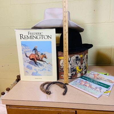 LOT 277: Cowboy Collection Featuring a Vintage Resistol Hat Box, Two (2) Cowboy Hats, Horseshoes and Books