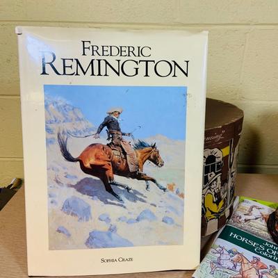 LOT 277: Cowboy Collection Featuring a Vintage Resistol Hat Box, Two (2) Cowboy Hats, Horseshoes and Books