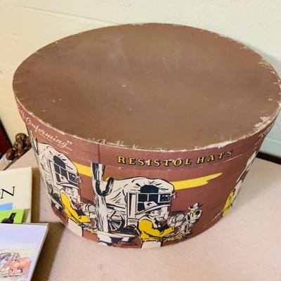 LOT 277: Cowboy Collection Featuring a Vintage Resistol Hat Box, Two (2) Cowboy Hats, Horseshoes and Books