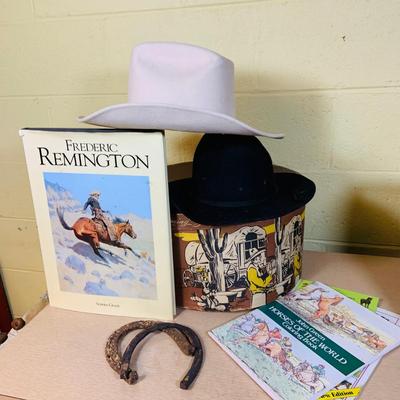 LOT 277: Cowboy Collection Featuring a Vintage Resistol Hat Box, Two (2) Cowboy Hats, Horseshoes and Books