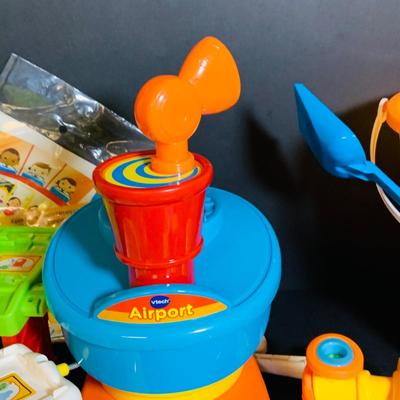 LOT 286: Collection of Children’s Toys Including Mr. Potato Head, V-Tech Airport Pieces, Fisher Price Puzzle and More