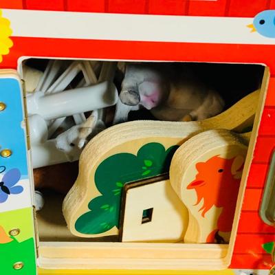 LOT 289. Melissa and Doug Latches Wooden Barn Full of Farm Puzzles and More; Set of Two Fisher Price Sing-ama-lings and Pop-up Books