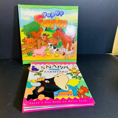 LOT 289. Melissa and Doug Latches Wooden Barn Full of Farm Puzzles and More; Set of Two Fisher Price Sing-ama-lings and Pop-up Books