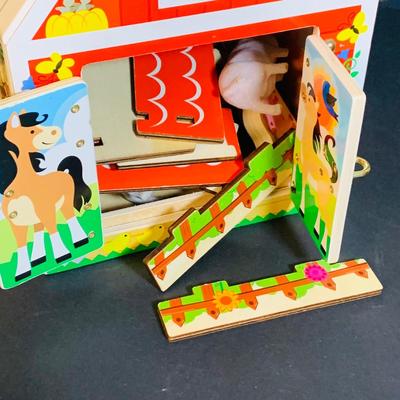 LOT 289. Melissa and Doug Latches Wooden Barn Full of Farm Puzzles and More; Set of Two Fisher Price Sing-ama-lings and Pop-up Books