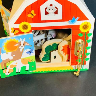 LOT 289. Melissa and Doug Latches Wooden Barn Full of Farm Puzzles and More; Set of Two Fisher Price Sing-ama-lings and Pop-up Books