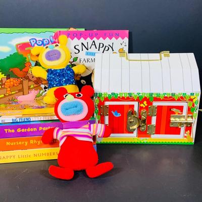 LOT 289. Melissa and Doug Latches Wooden Barn Full of Farm Puzzles and More; Set of Two Fisher Price Sing-ama-lings and Pop-up Books