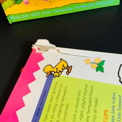 LOT 289. Melissa and Doug Latches Wooden Barn Full of Farm Puzzles and More; Set of Two Fisher Price Sing-ama-lings and Pop-up Books