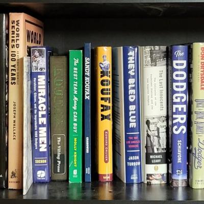 LOT 308: Bookshelf of Various Sports Books