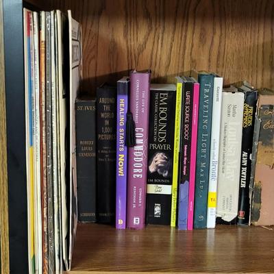 LOT 310: Two Bookshelf Rows of Assortment of Christian Books