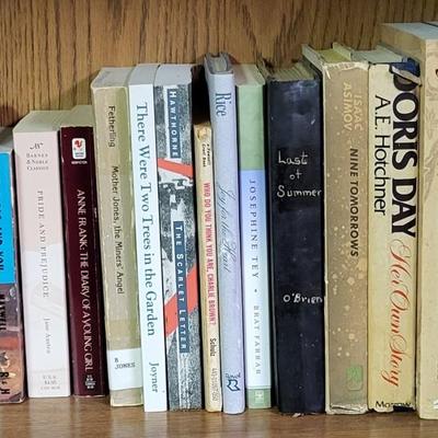 LOT 310: Two Bookshelf Rows of Assortment of Christian Books