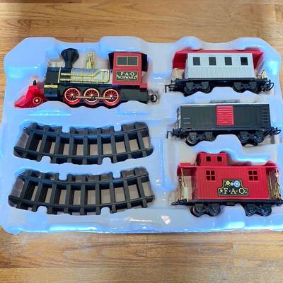 LOT 316: FAO Schwarz 30-Piece Motorized Train Set in Original Box