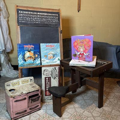 LOT 339: Vintage Children" Desk & Chalkboard, Erector Set Box, Pink Metal Stove along with 4 Children's Books