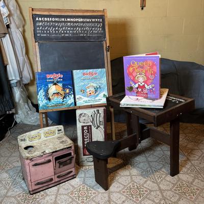 LOT 339: Vintage Children" Desk & Chalkboard, Erector Set Box, Pink Metal Stove along with 4 Children's Books