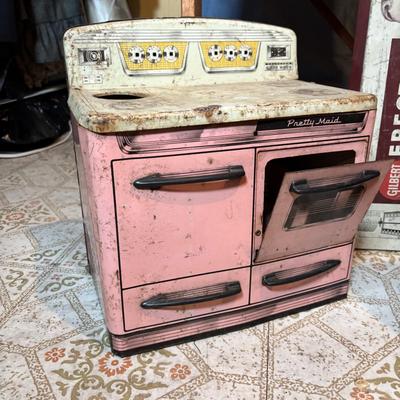 LOT 339: Vintage Children" Desk & Chalkboard, Erector Set Box, Pink Metal Stove along with 4 Children's Books