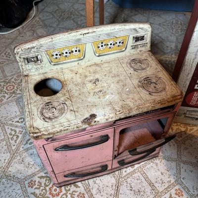 LOT 339: Vintage Children" Desk & Chalkboard, Erector Set Box, Pink Metal Stove along with 4 Children's Books