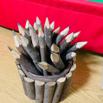 LOT 353: Children’s Desk Full of Learning Essentials Including Colorful Canvas and Wood Book Stand, Rustic Log Pencils and Pens, Storage...