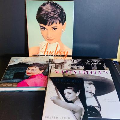 LOT 360: Collection Inspired by Remarkable Women Including Judy Garland Book and Stamps, Audrey Hepburn Books, and More