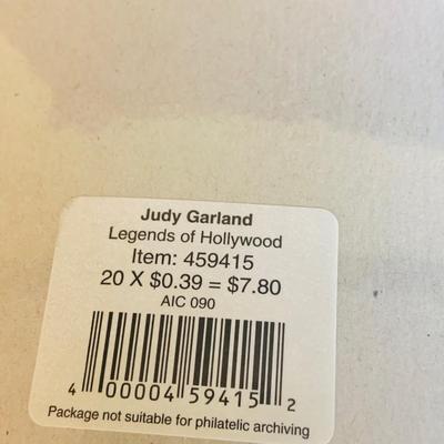 LOT 360: Collection Inspired by Remarkable Women Including Judy Garland Book and Stamps, Audrey Hepburn Books, and More