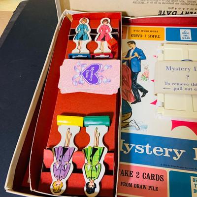 LOT 369: Collection of Games Including Vintage Mystery Date Game, Twister, Simon and More