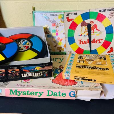 LOT 369: Collection of Games Including Vintage Mystery Date Game, Twister, Simon and More